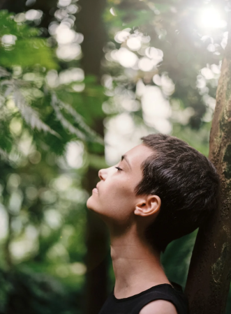 Women Meditating In Forest